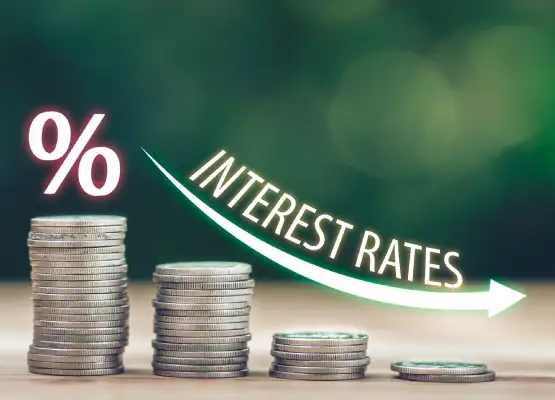 stacked coins arrow down interest rates
